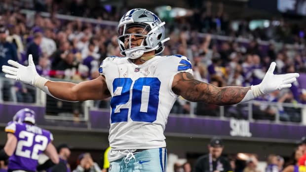 Nov 20, 2022; Minneapolis, Minnesota, USA; Dallas Cowboys running back Tony Pollard (20) celebrates his touchdown during the third quarter against the Minnesota Vikings at U.S. Bank Stadium.